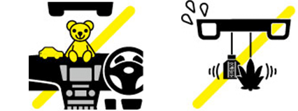 フロントガラスやダッシュボードの禁止エリアにアクセサリーを付けたり、物を置いたりしないでください。